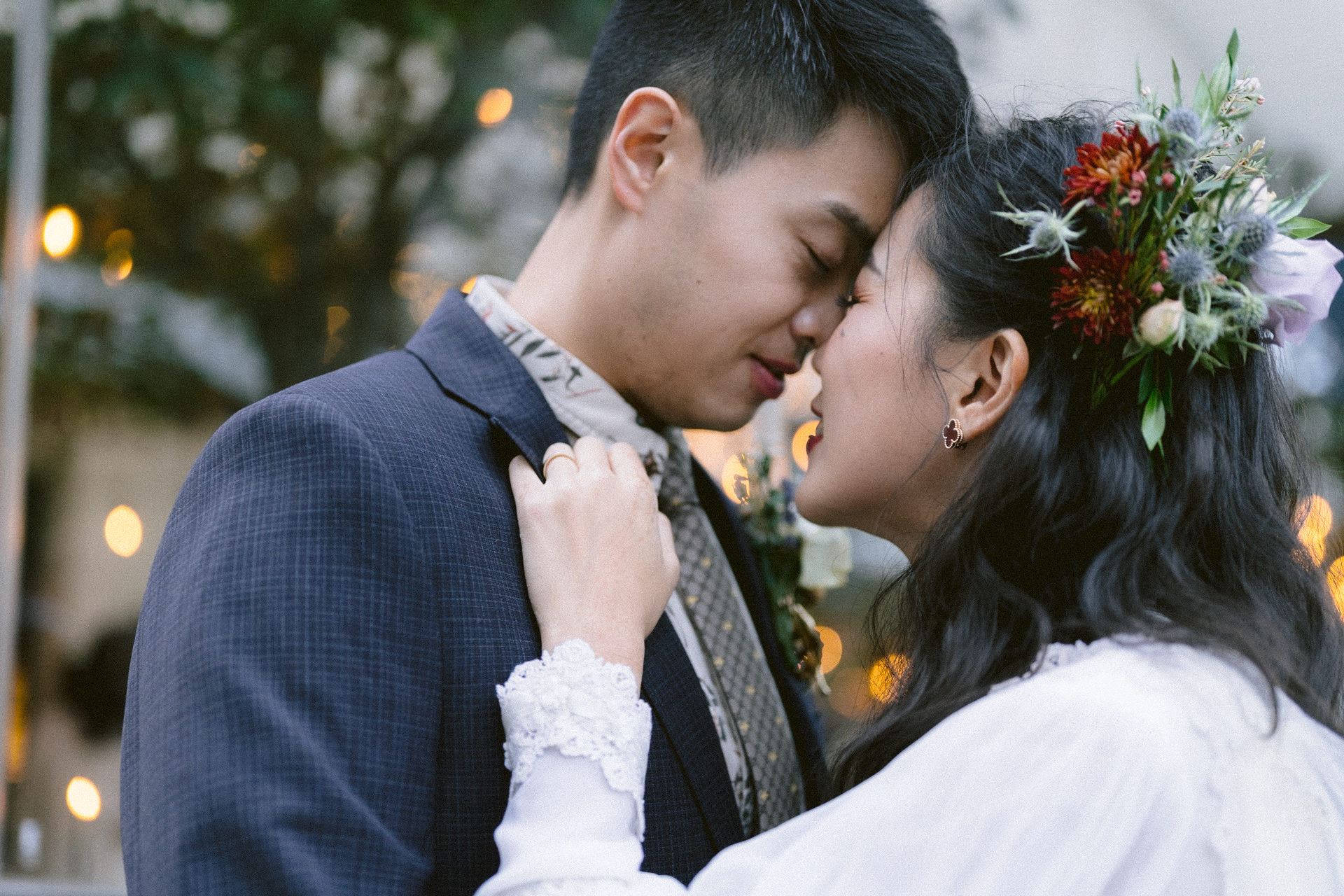 A couple in wedding attire sharing an intimate moment