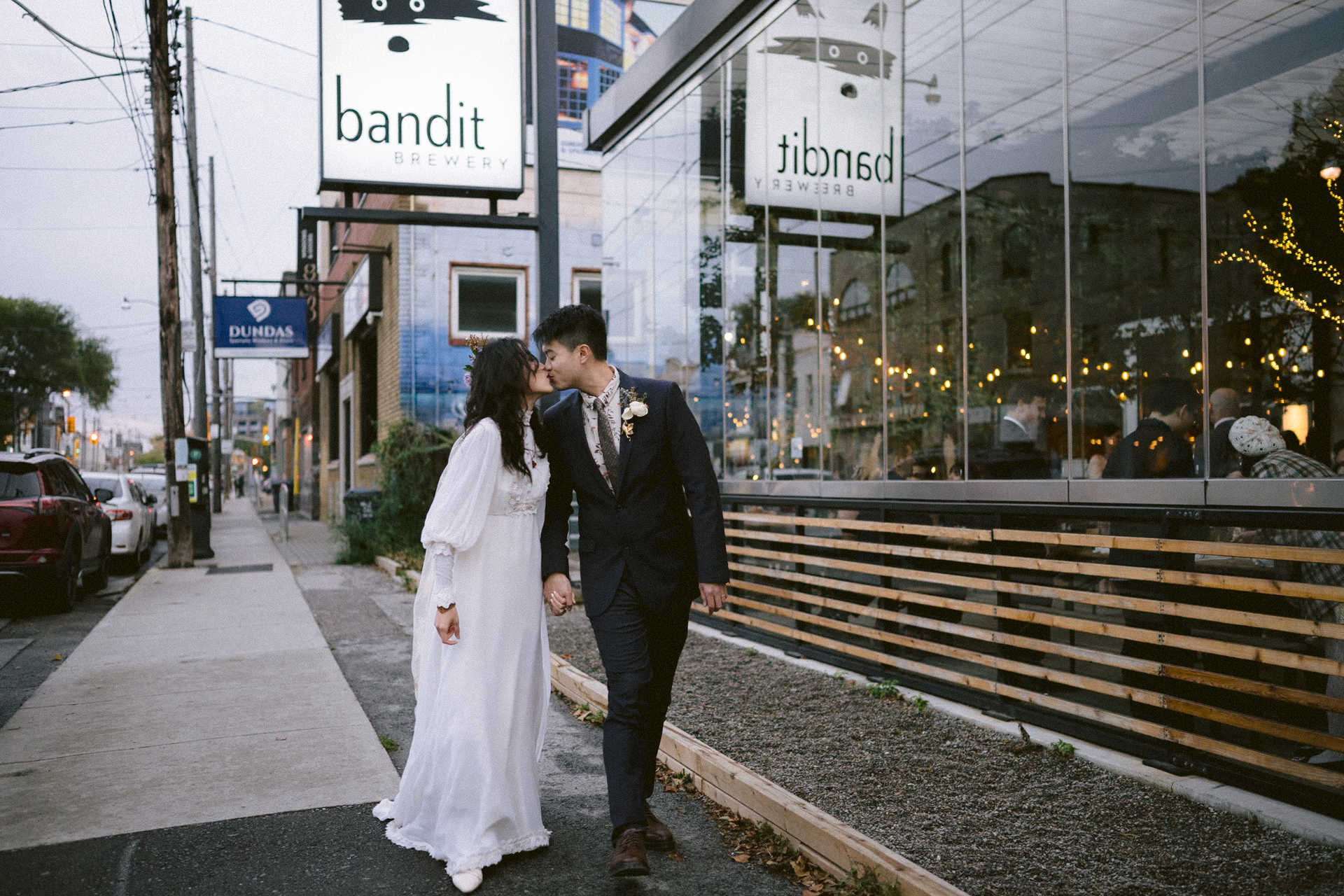 A couple in wedding attire sharing an intimate moment