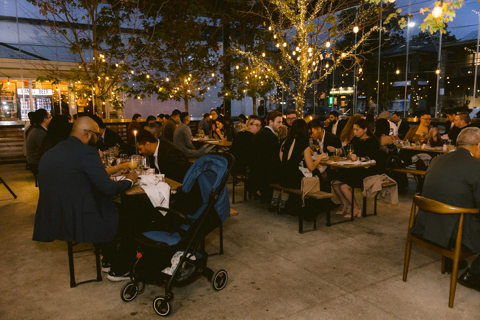 A micro-wedding held at Bandit Brewery, Toronto with tungsten light hanging on the roof.