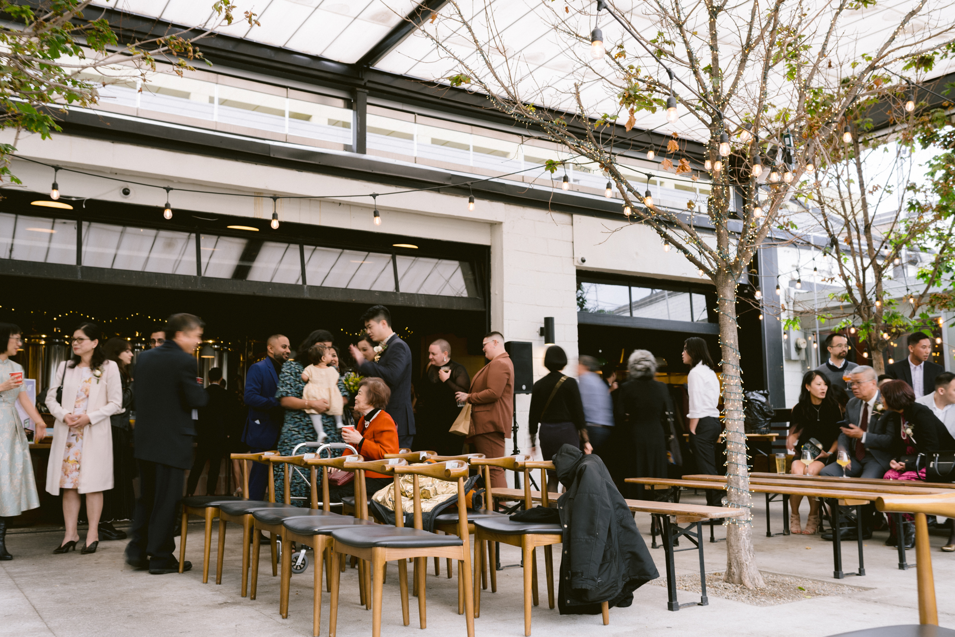 Guests mingle around before the begin of a micro-wedding at Toronto.