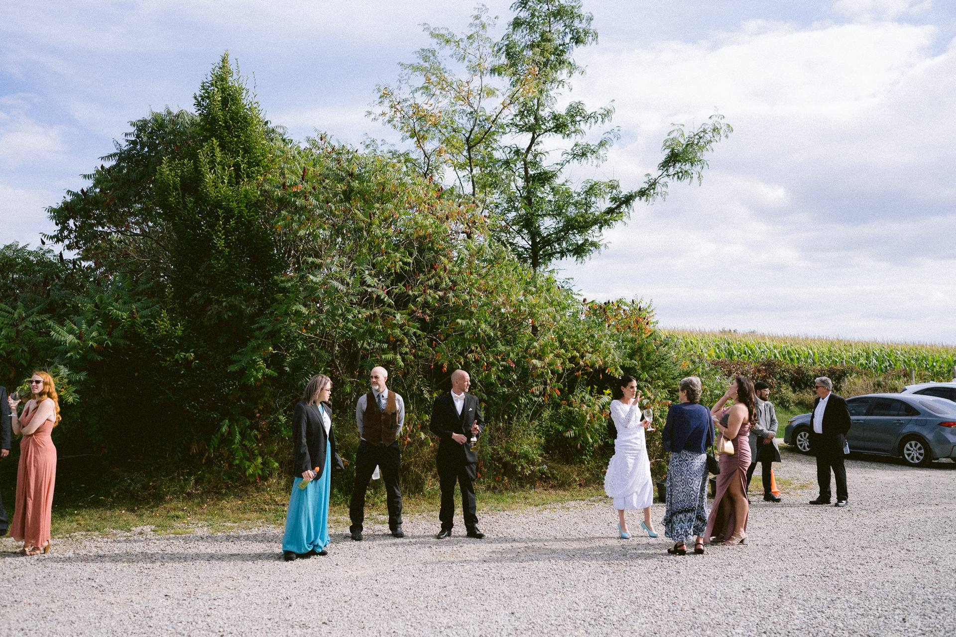 Guests relax outdoors during cocktail hour before reception.