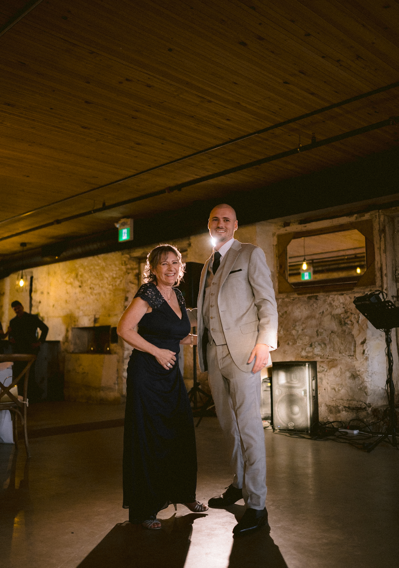 Groom and his mother looked at the Toronto wedding photographer direction when they are on the dance floor.
