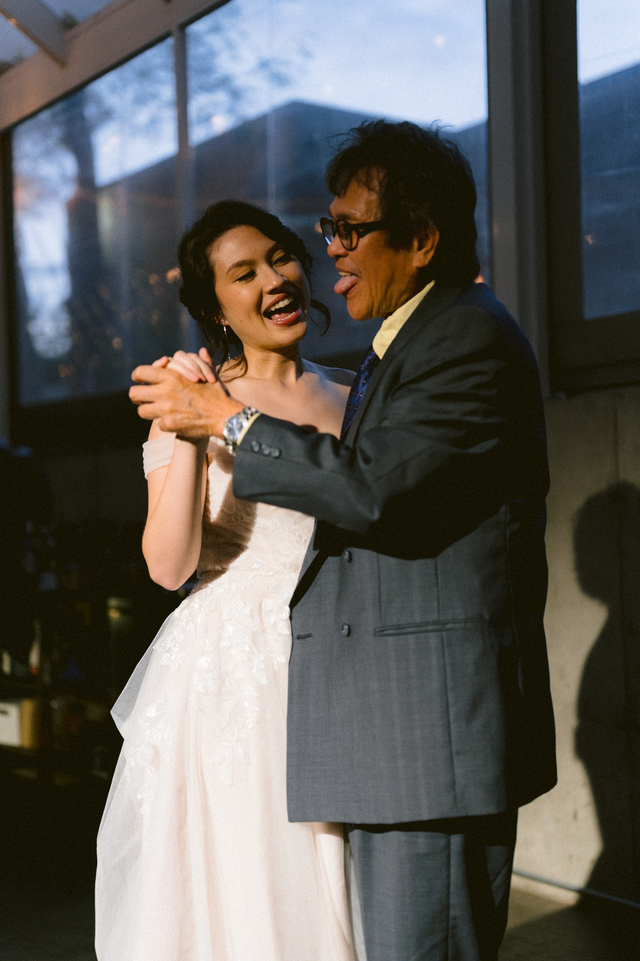 Close-up of bride's happy tears during the parent dance with her father.