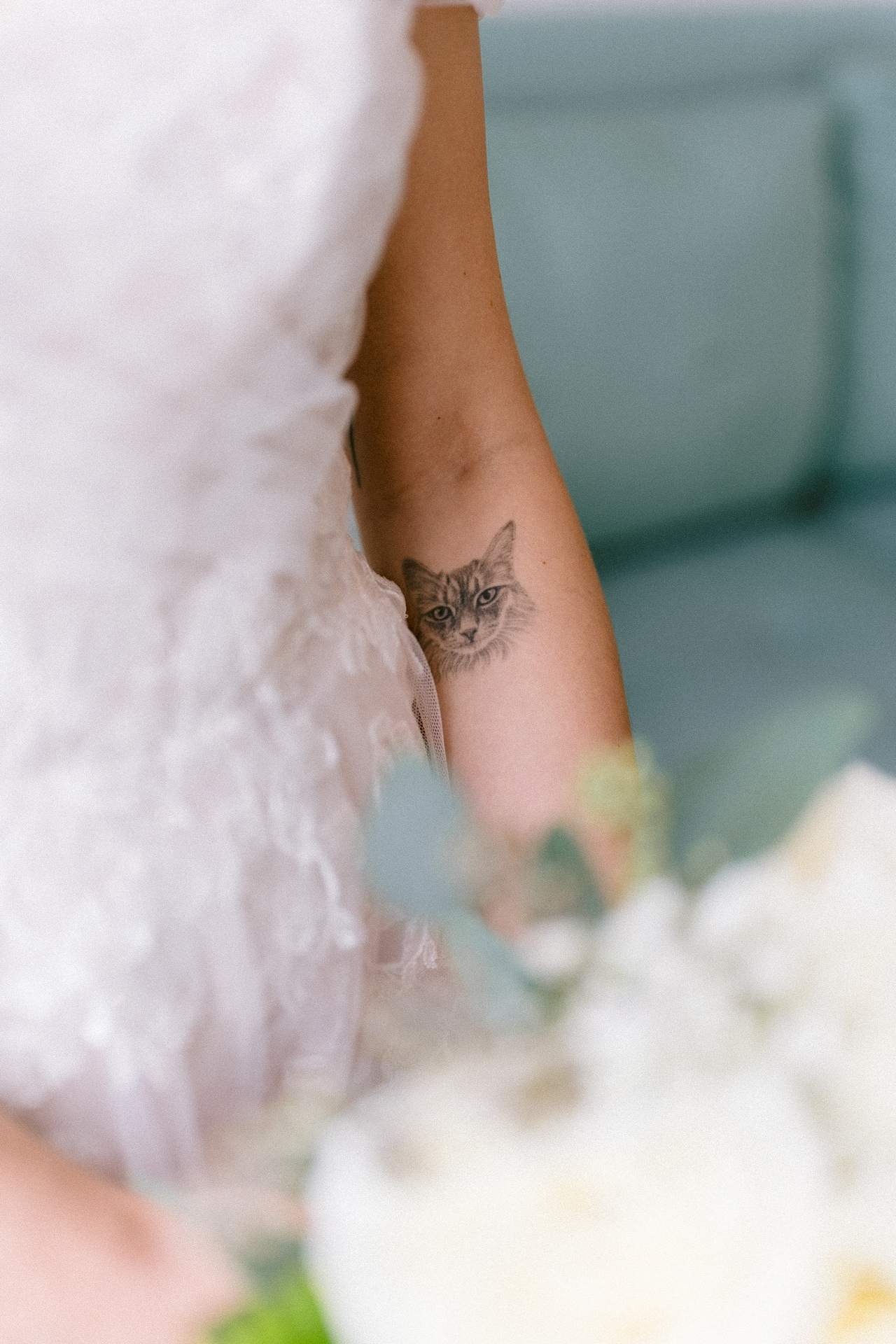 Bride holding a bouquet of white roses