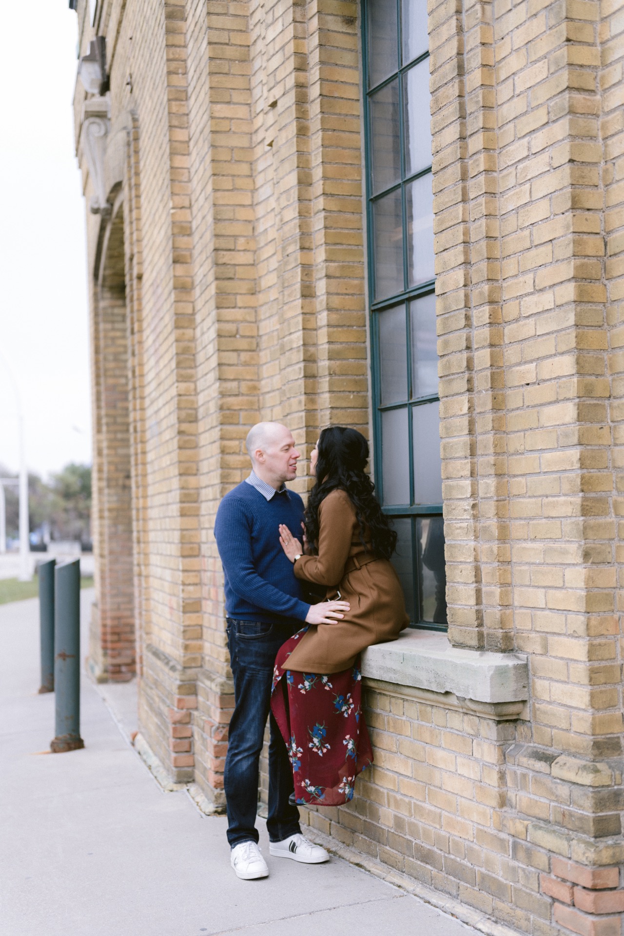 Close-up of a smiling couple embracing, focusing on their affectionate gesture.