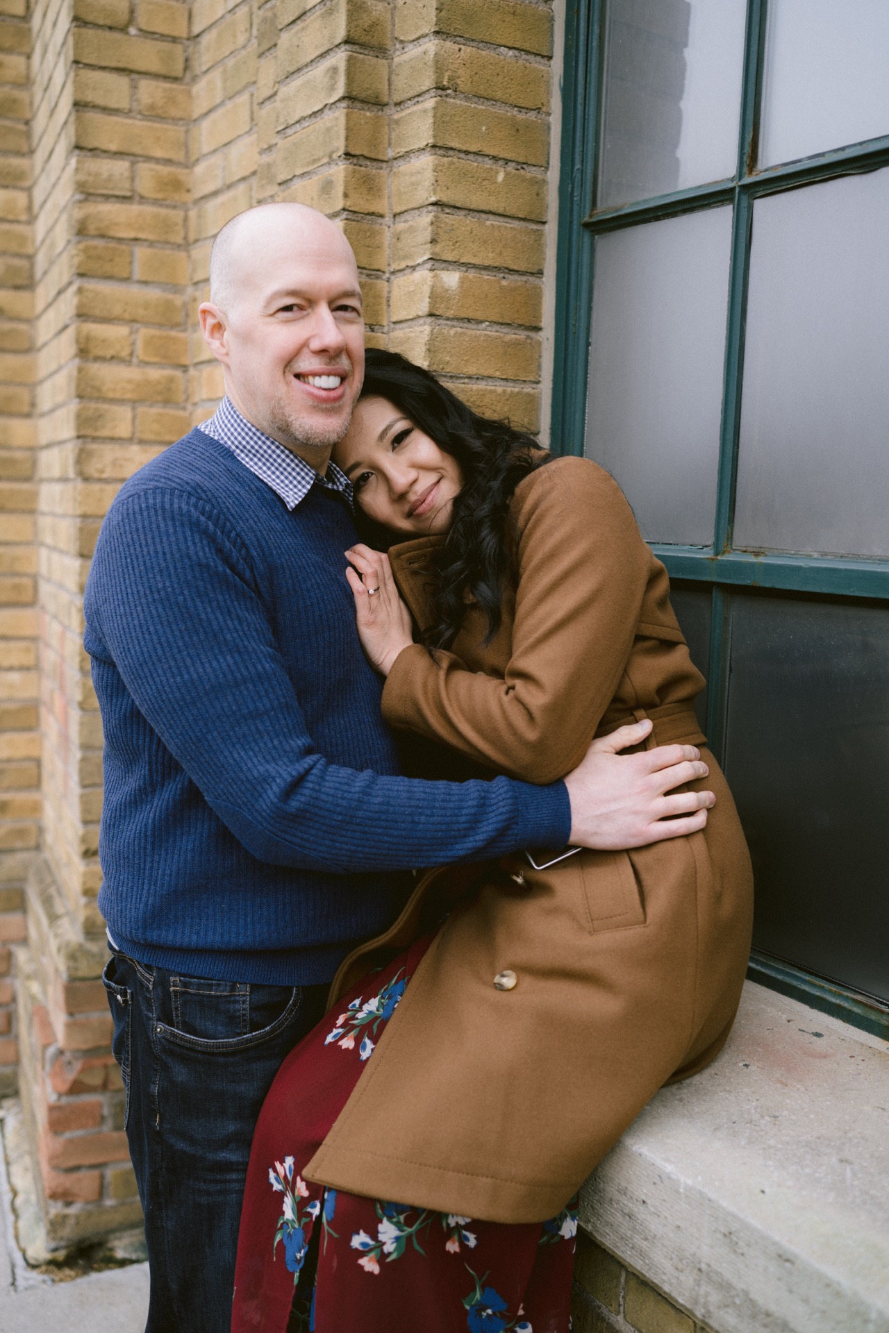 Close-up of a smiling couple embracing, focusing on their affectionate gesture.
