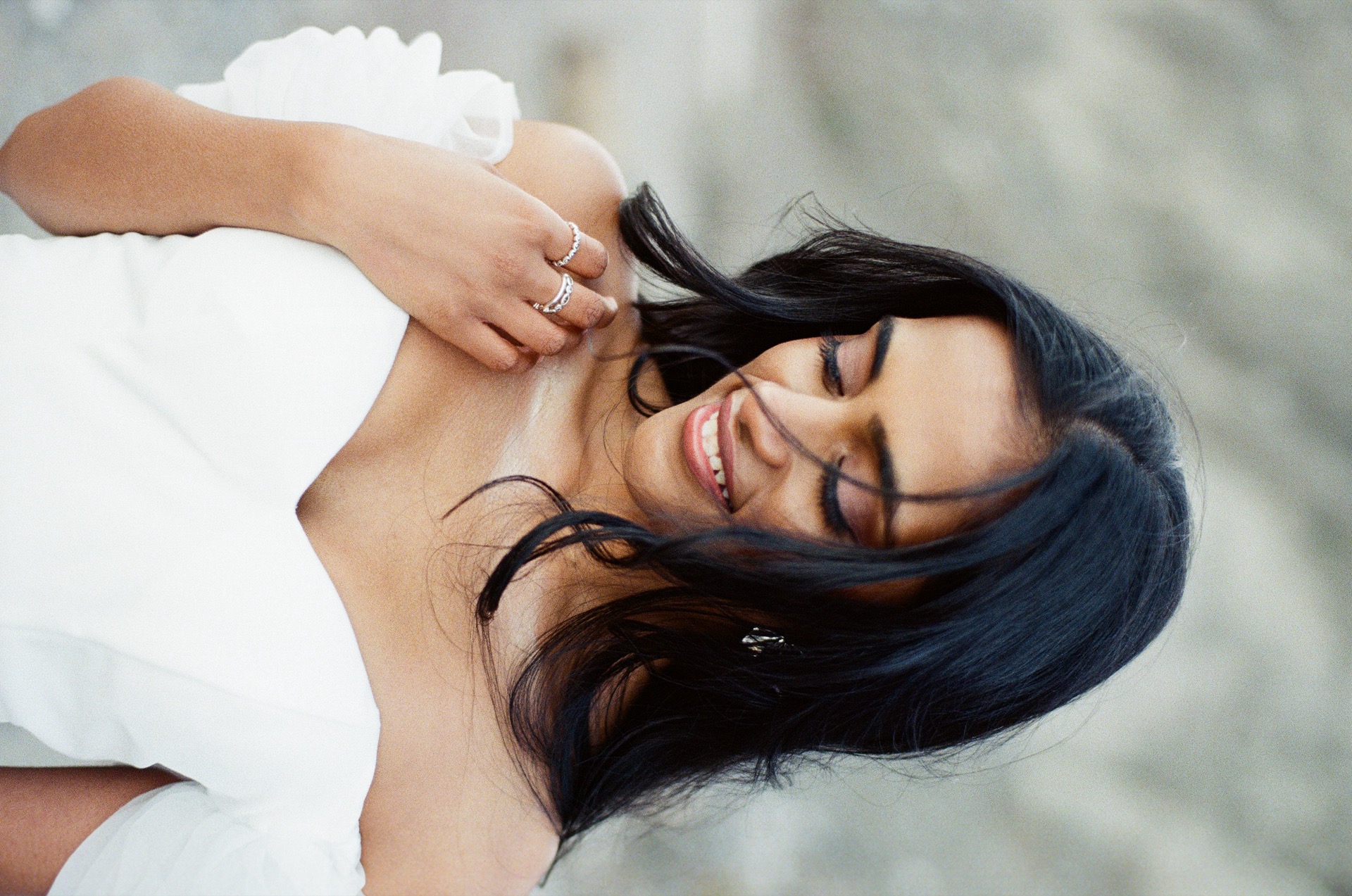 Close up of a bride playing with her hair for the wedding portrait