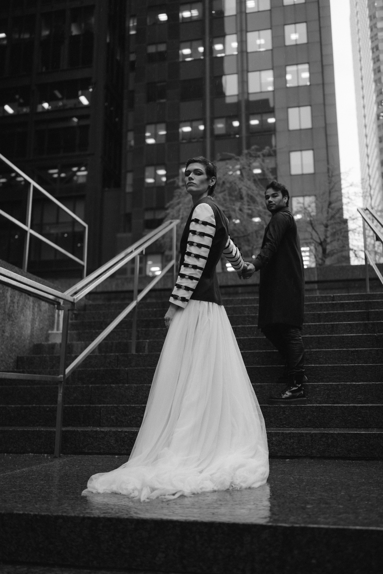 Gay couple looking at each other for their romantic couple portrait.