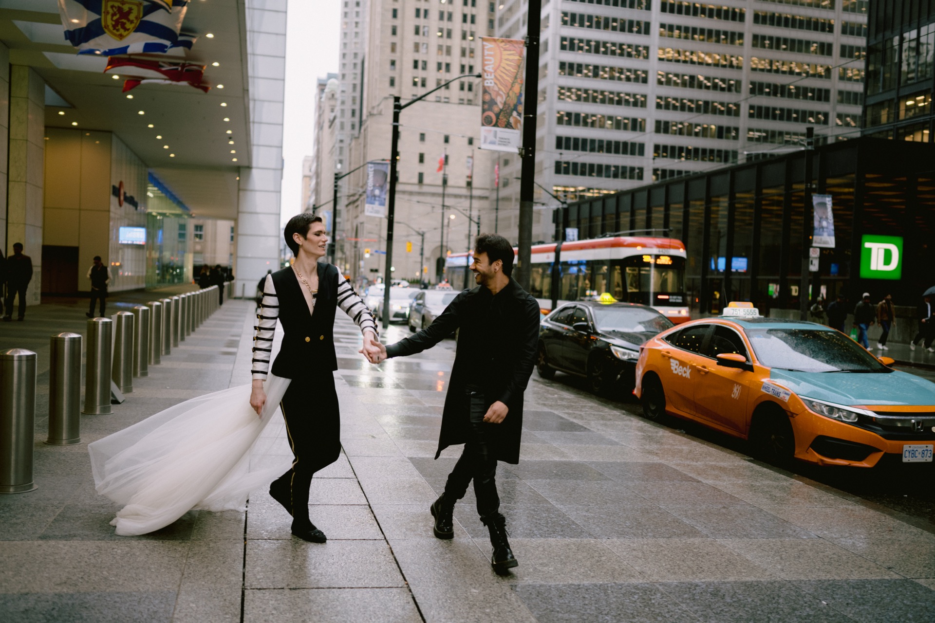 Gay couple's candid moment in rain.