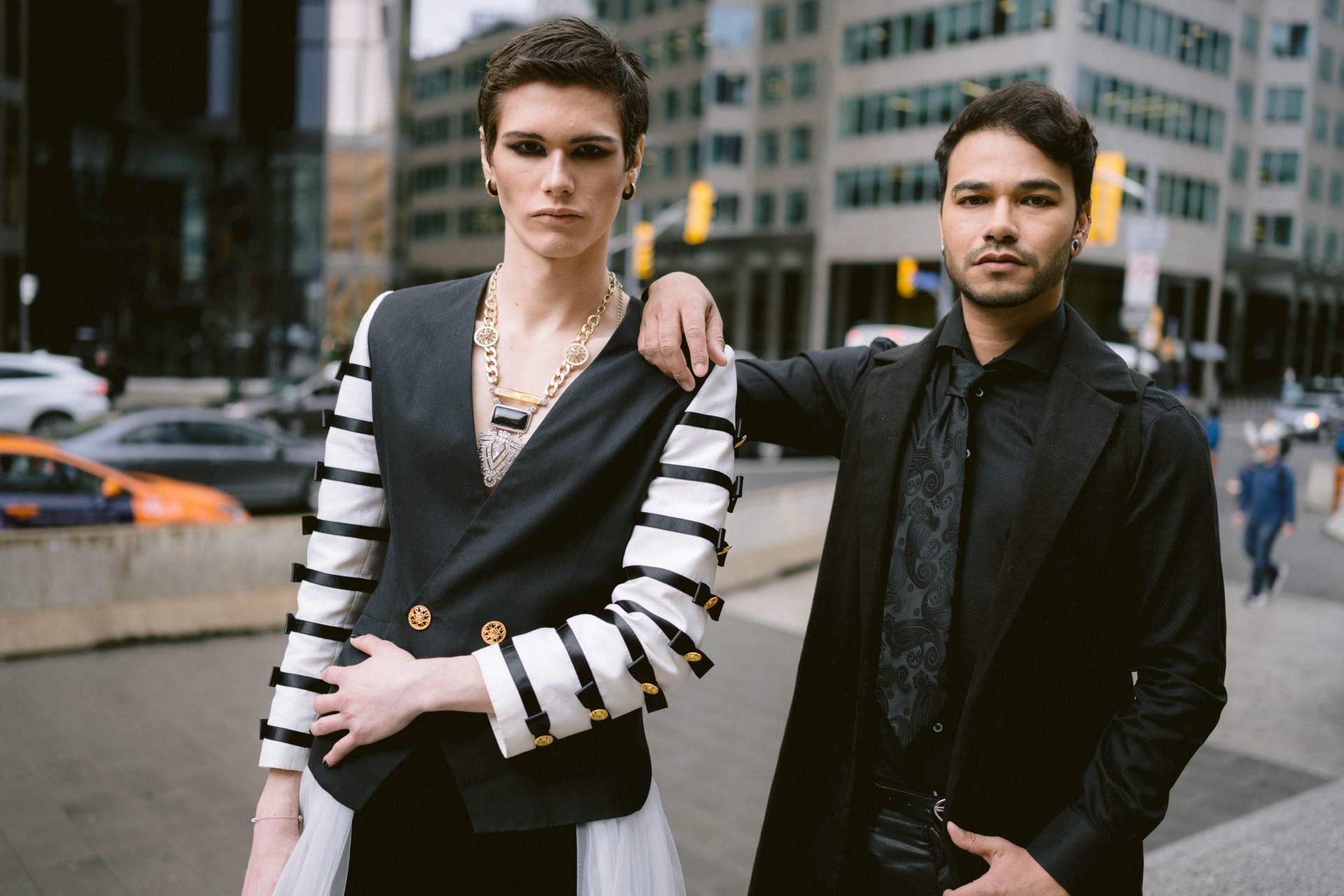 Gay couple posing by Union Station's clock.