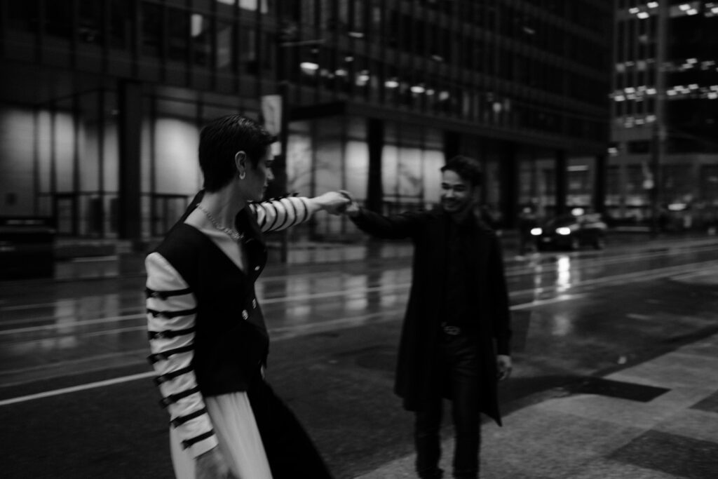 LGBTQ couple enjoying rainy day.