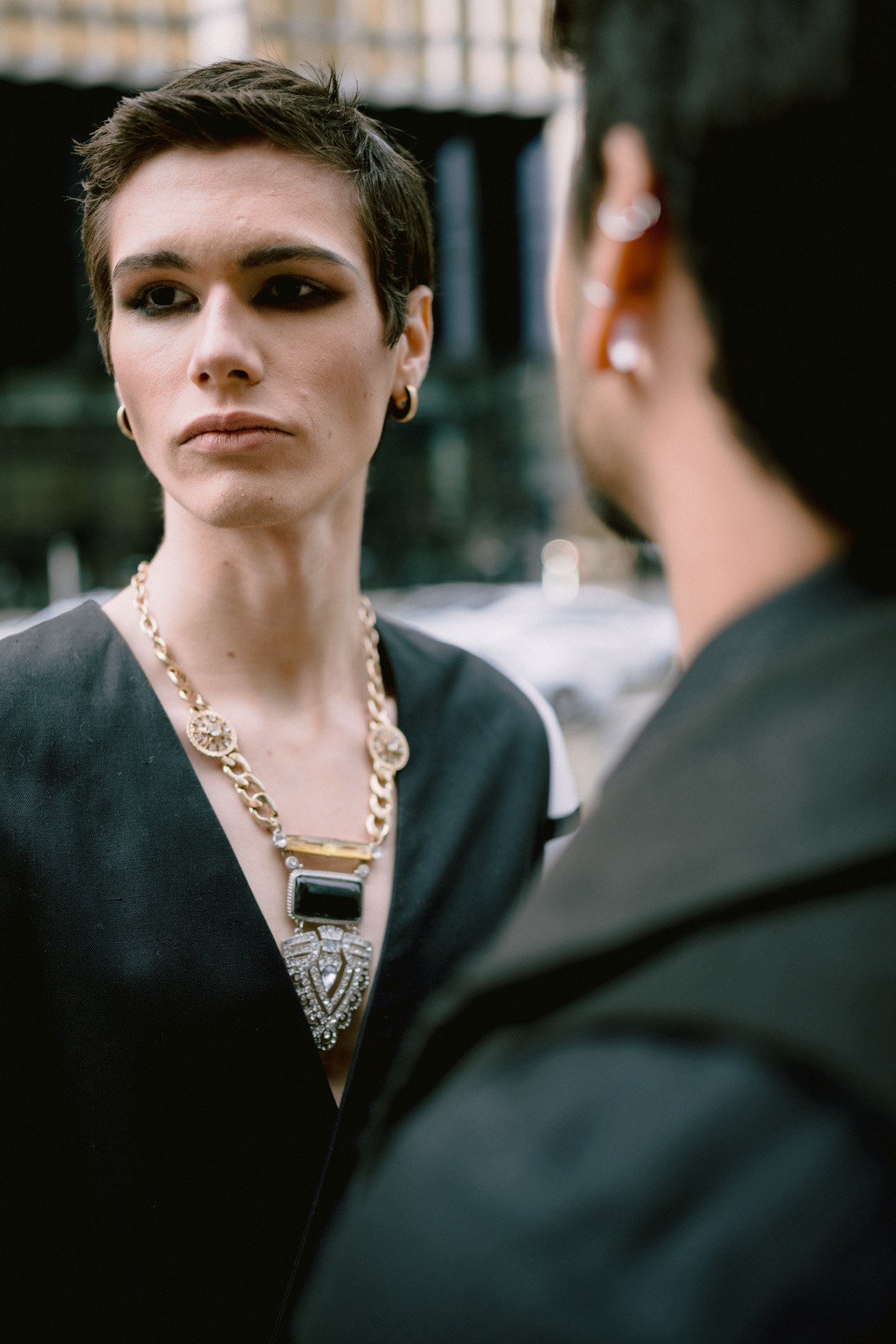 LGBTQ couple standing close at Union Station for their wedding photos.