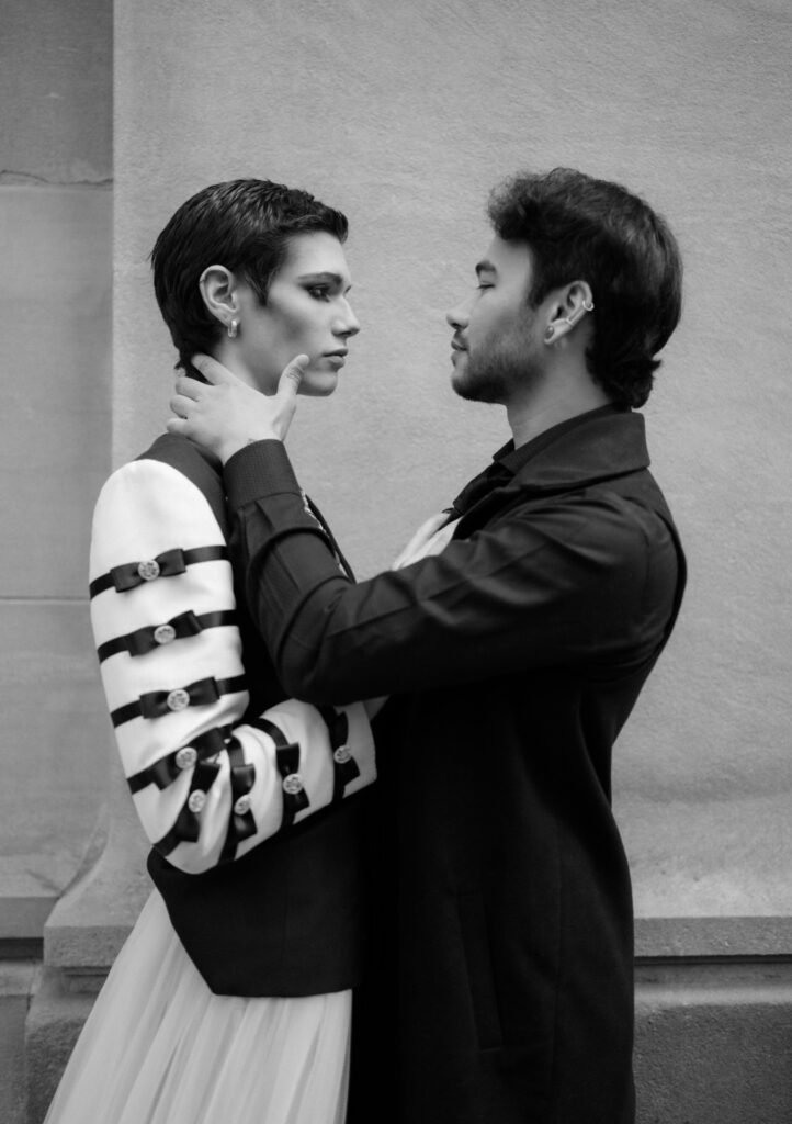 Romantic LGBTQ couple kiss in the rain