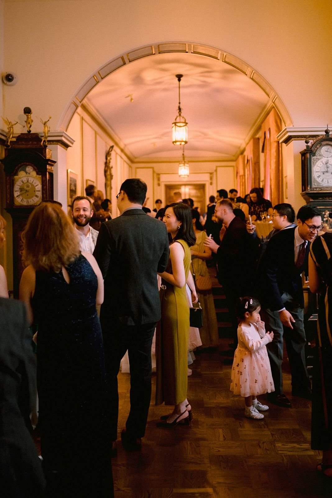 Guests mingle around during cocktail hour at University Club of Toronto
