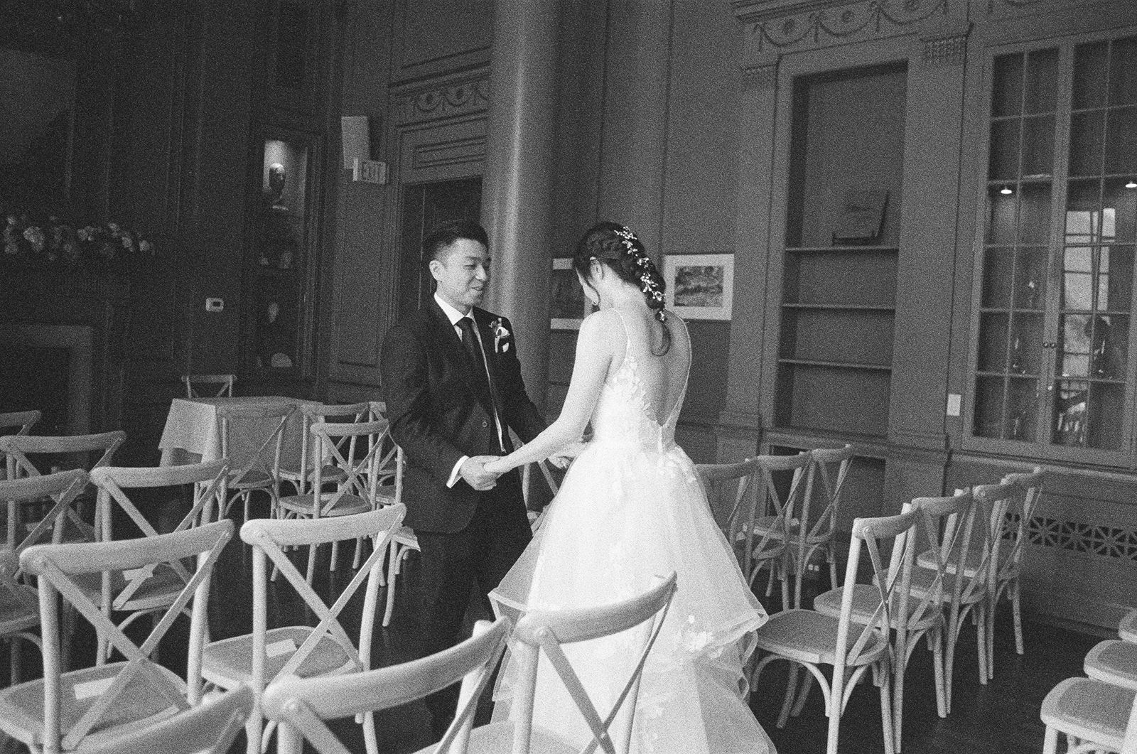 Documentary wedding photography of a groom seeing his bride for the first time.