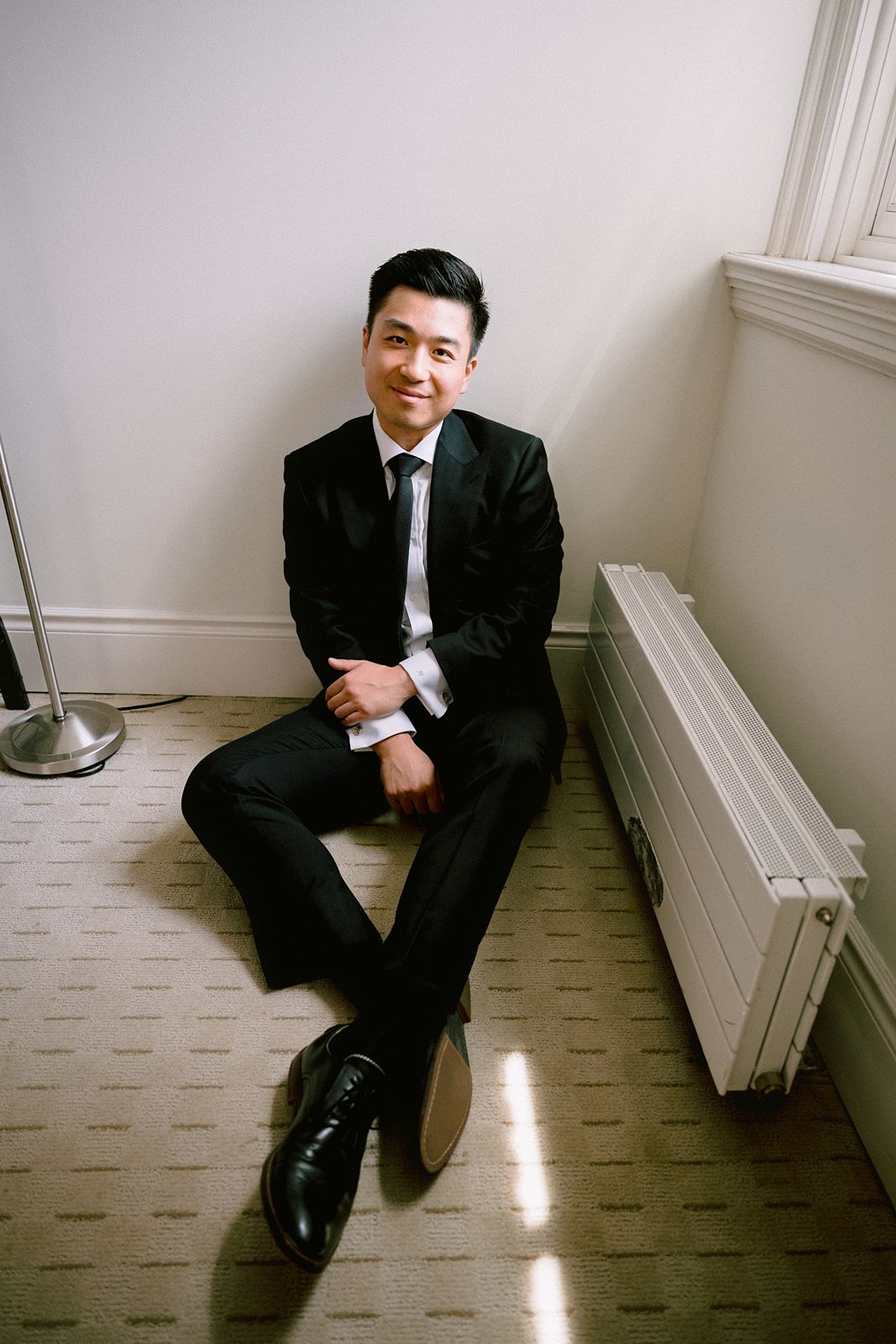 Groom portrait in his hotel room at University Club of Toronto
