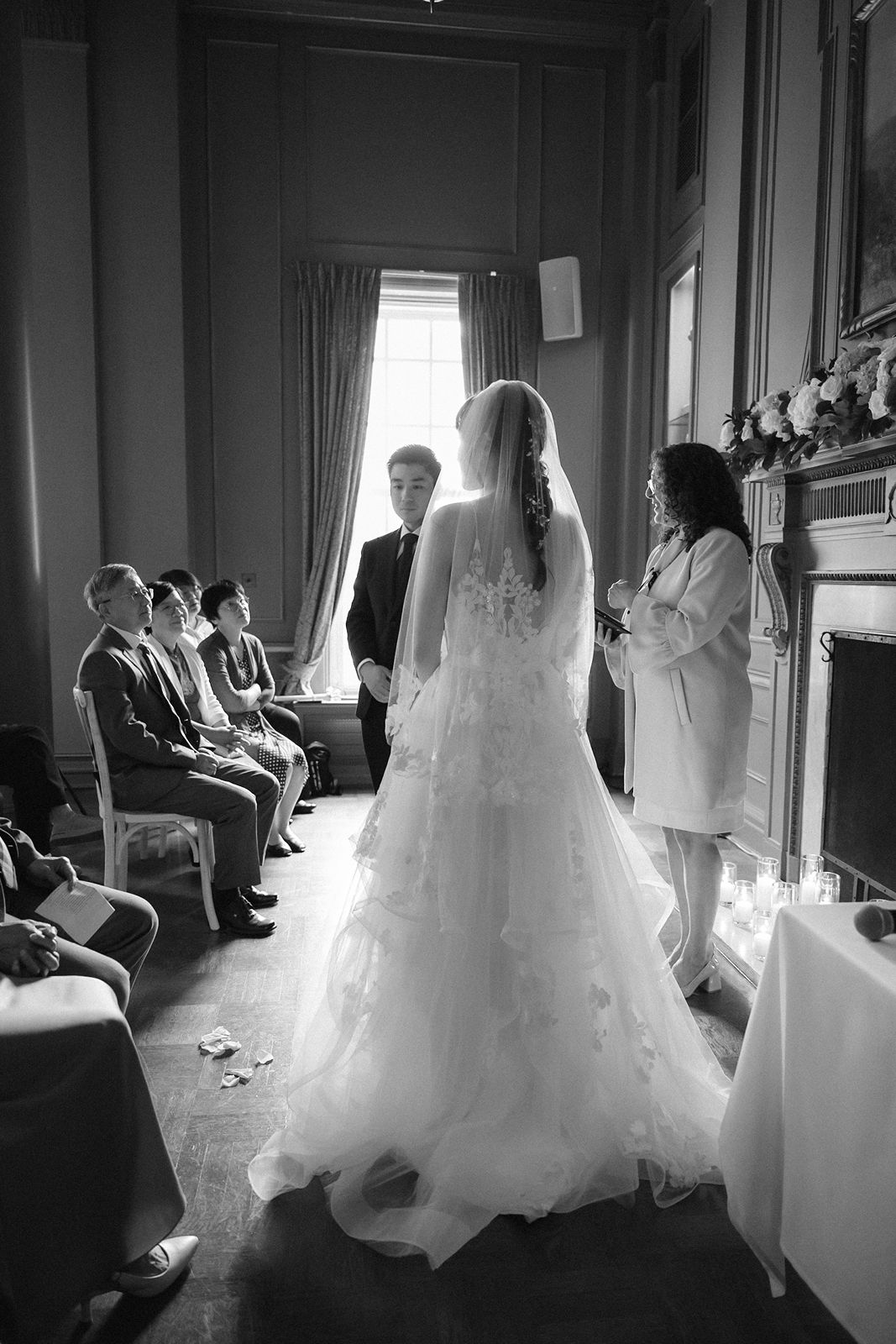 Sunlight streaming through historic windows during a Toronto wedding.
