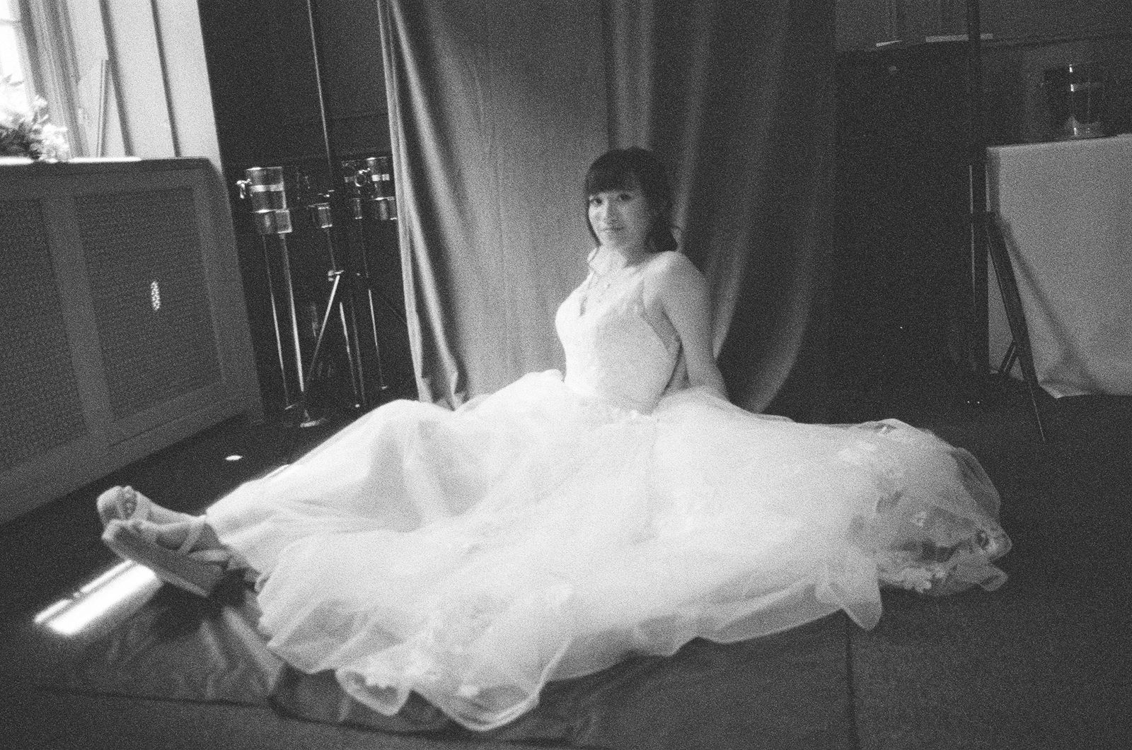 Elegant bride posing in a historic Toronto library setting.