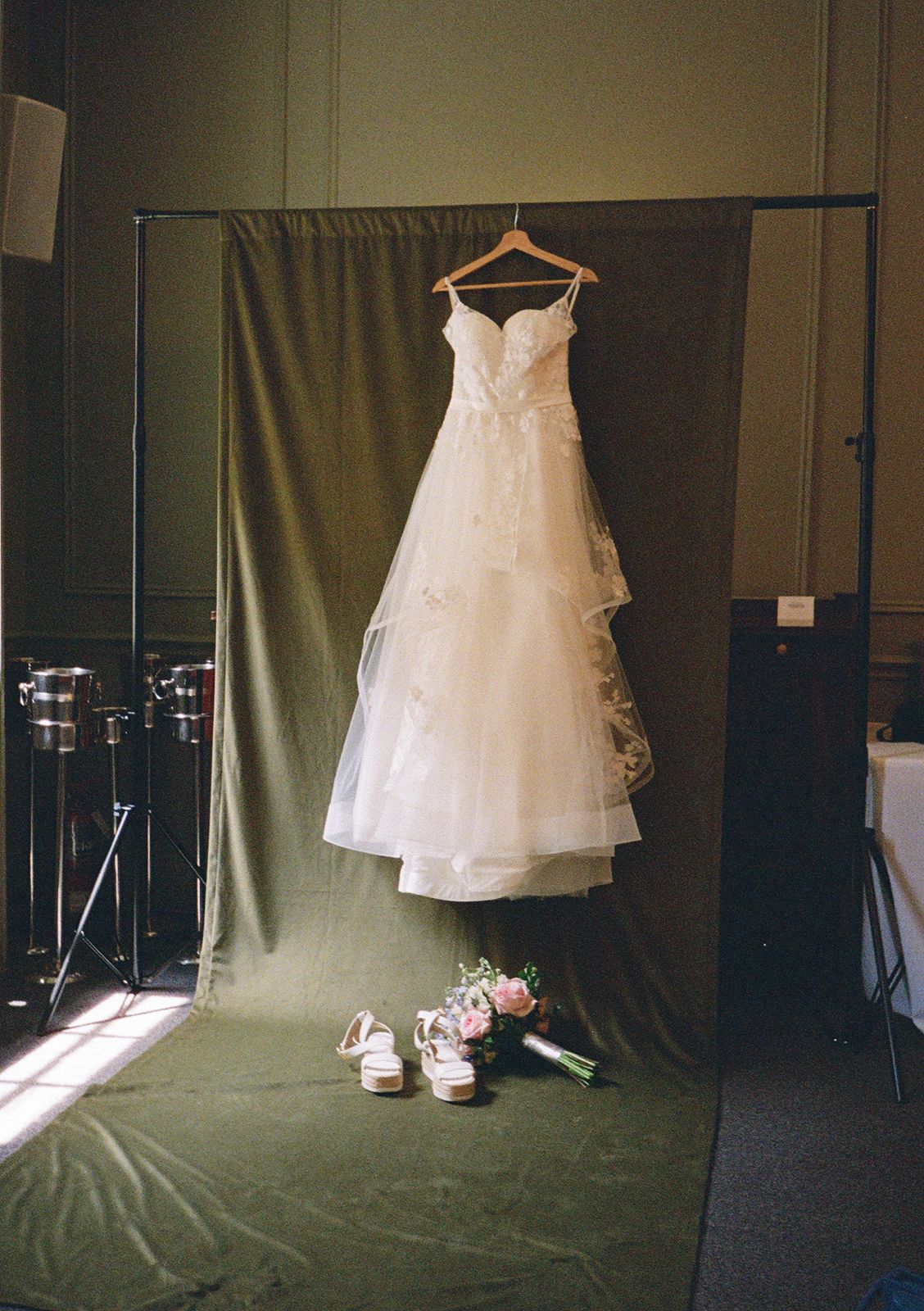 Wedding dress hanging at the backdrop setup at University Club of Toronto