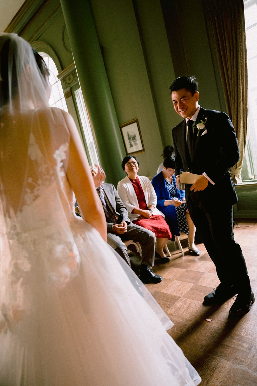 Groom crying during emotional first look at University Club of Toronto.