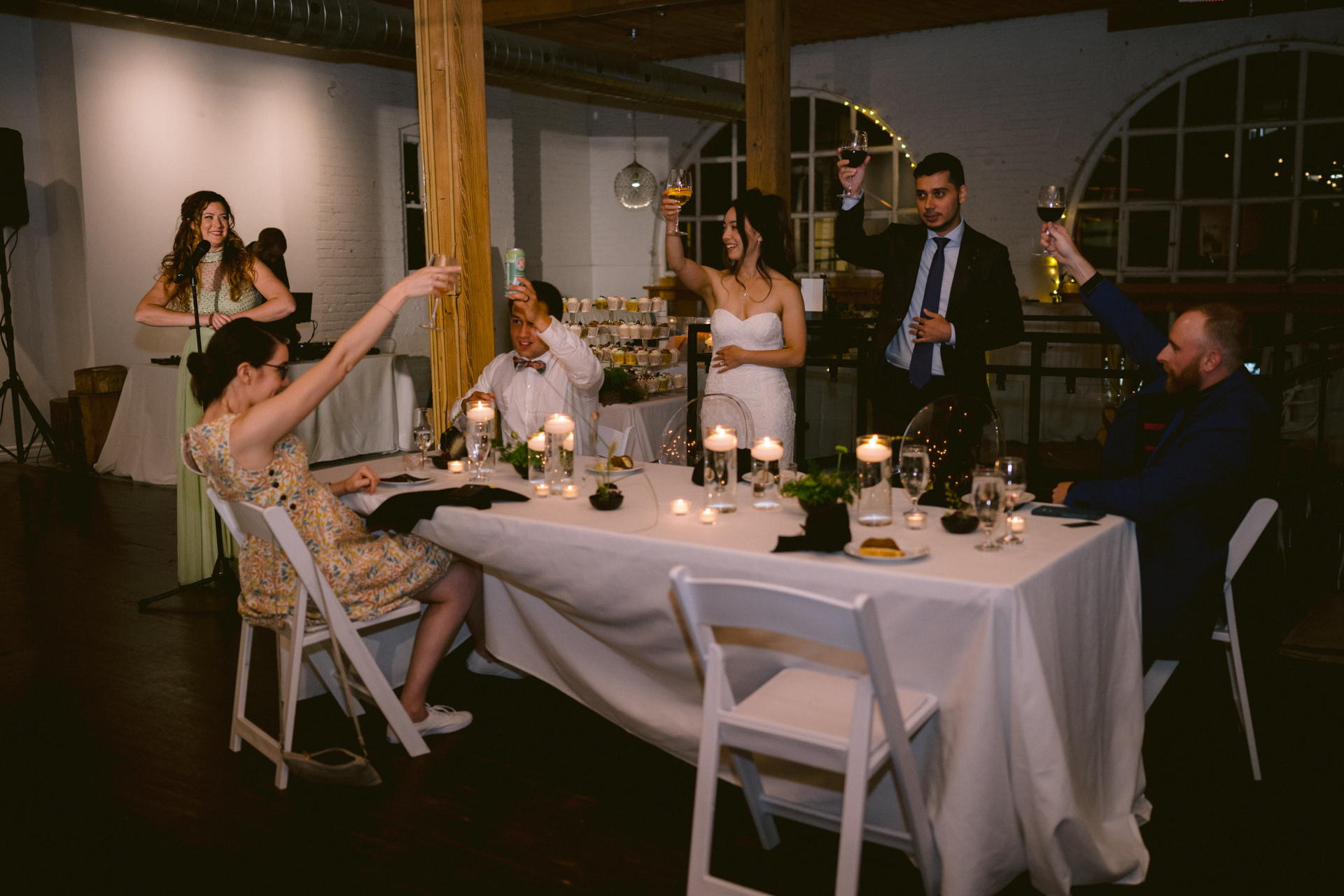 Guests toasting with wine glasses at a wedding