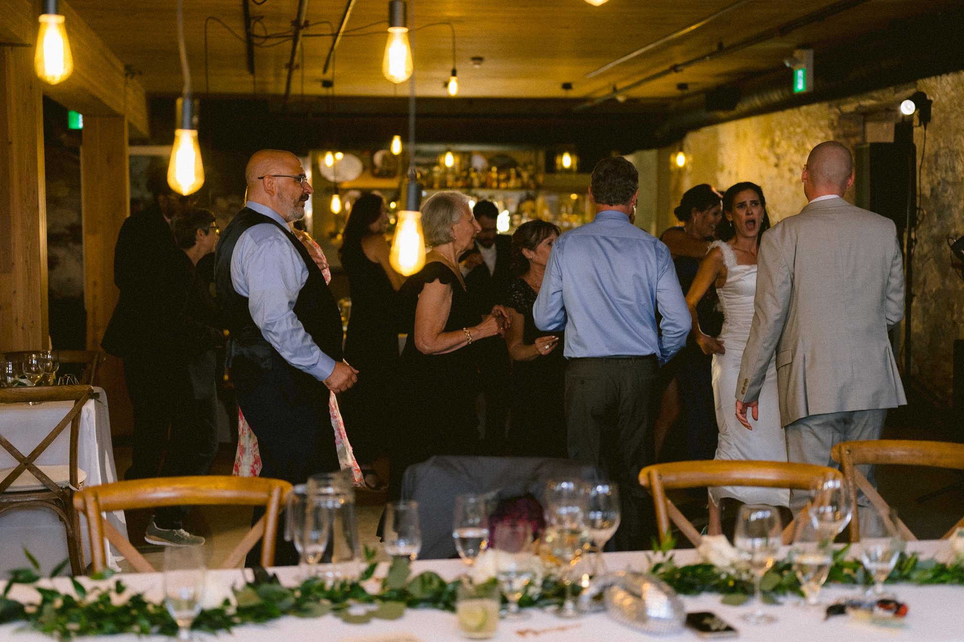 Guests joined the couple on the dance floor when Toronto wedding photographer took a wide shot of the event.