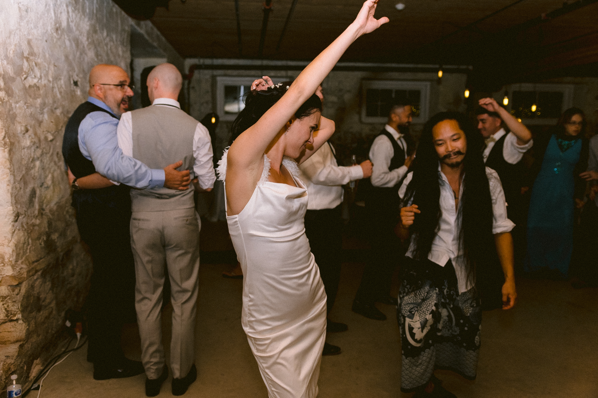 A bride joined her guests dancing at the dance floor at Cambium Farms.