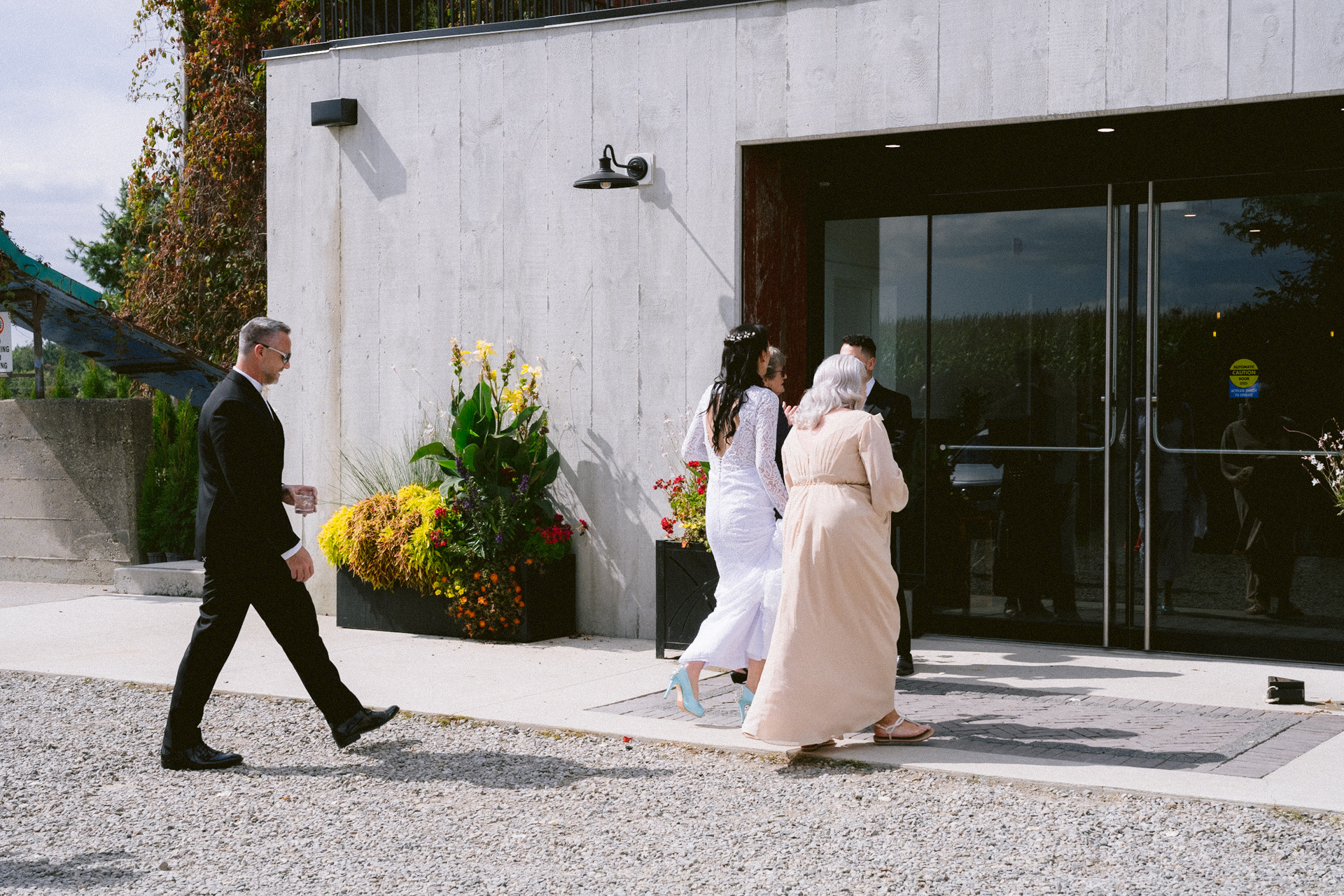 A bride and her family stepped into The Byre, at Cambium Farms followed by her Toronto wedding photographer.
