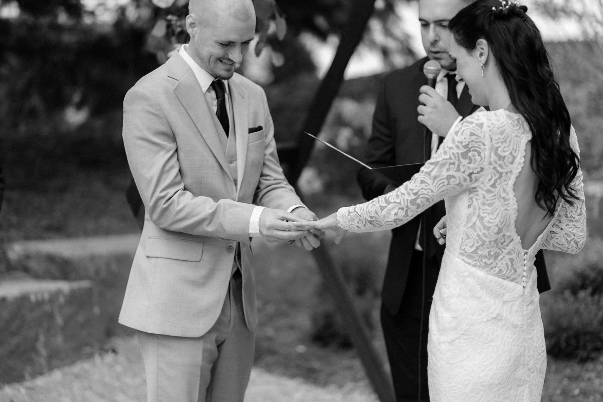 Bride and groom exchanged the wedding rings with their close friend as their wedding officiant
