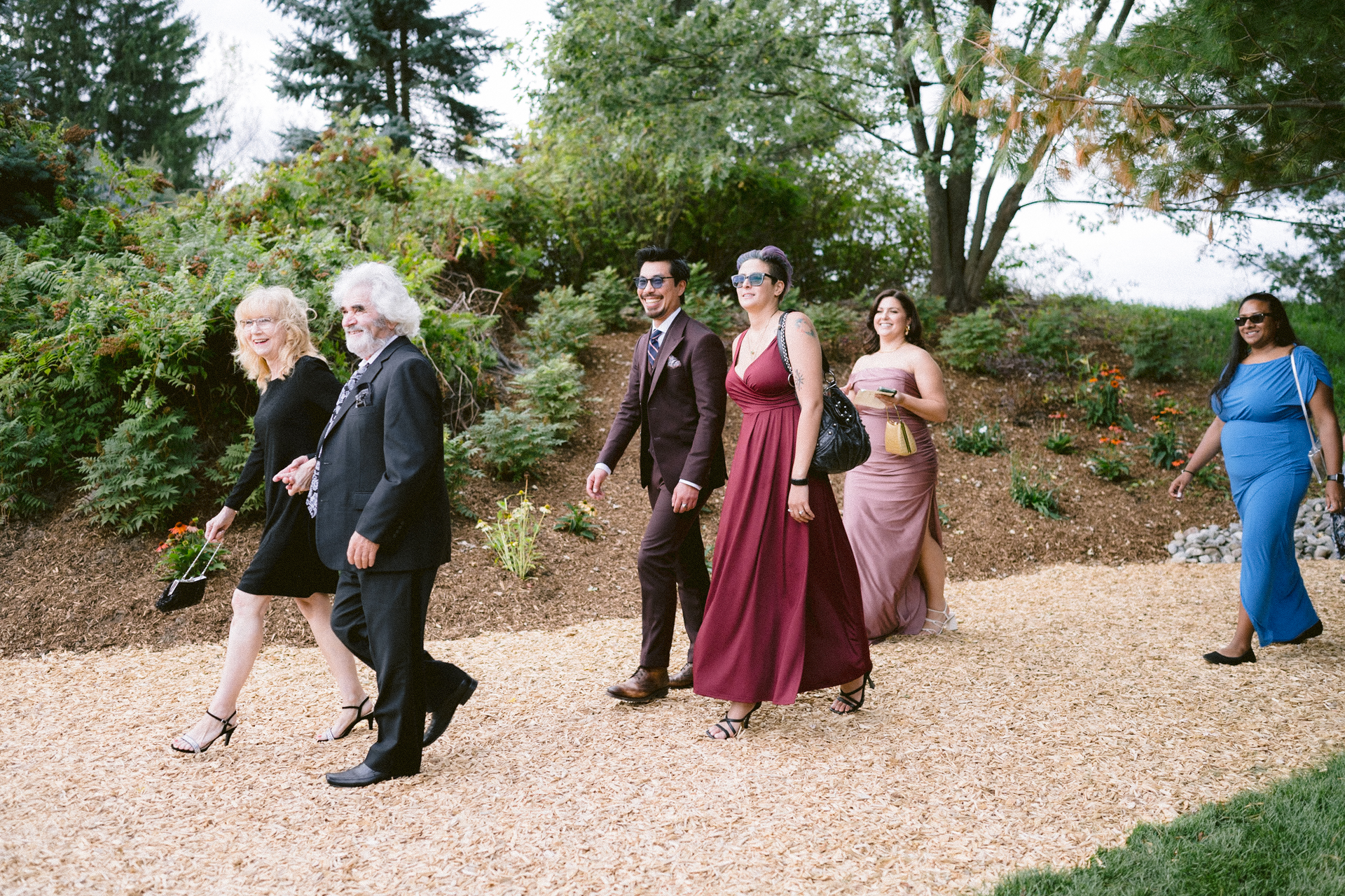 Guests leaving the wedding ceremony and heading for cocktail hour.