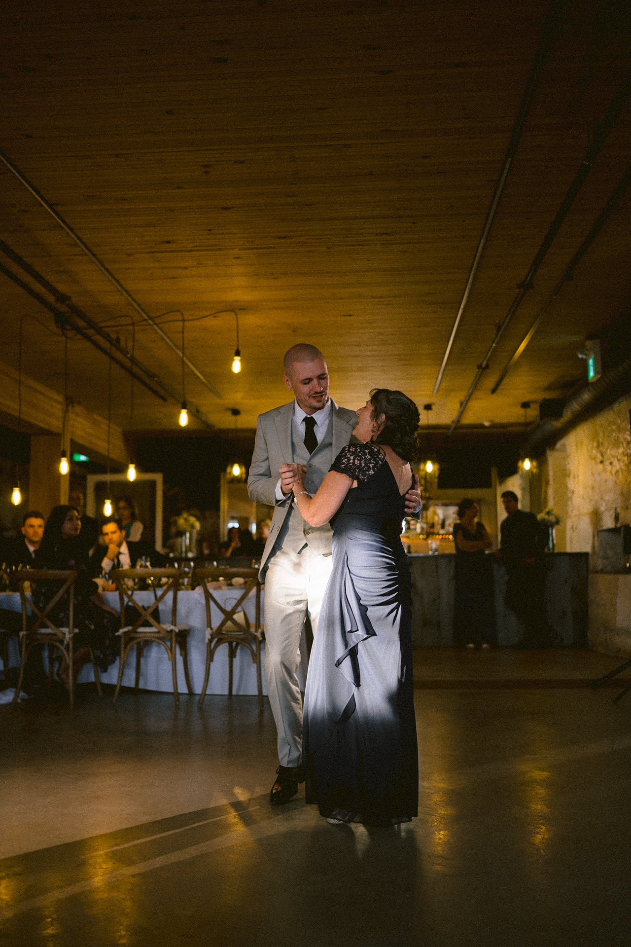 Groom holds his mother and performed a romantic parent dance.