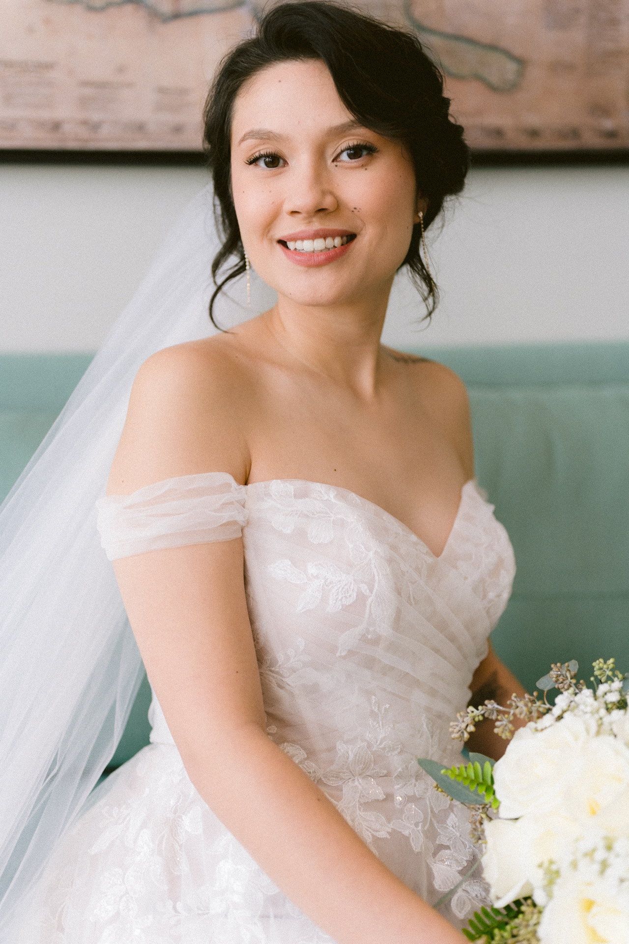 Bride holding a bouquet of white roses
