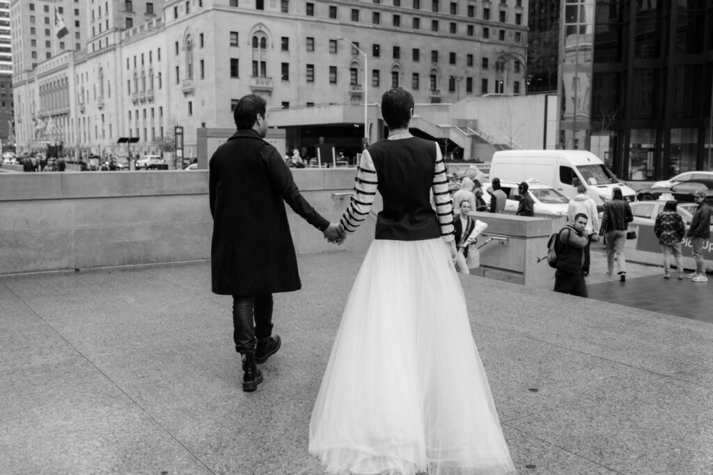 Gay couple walking through Union Station.