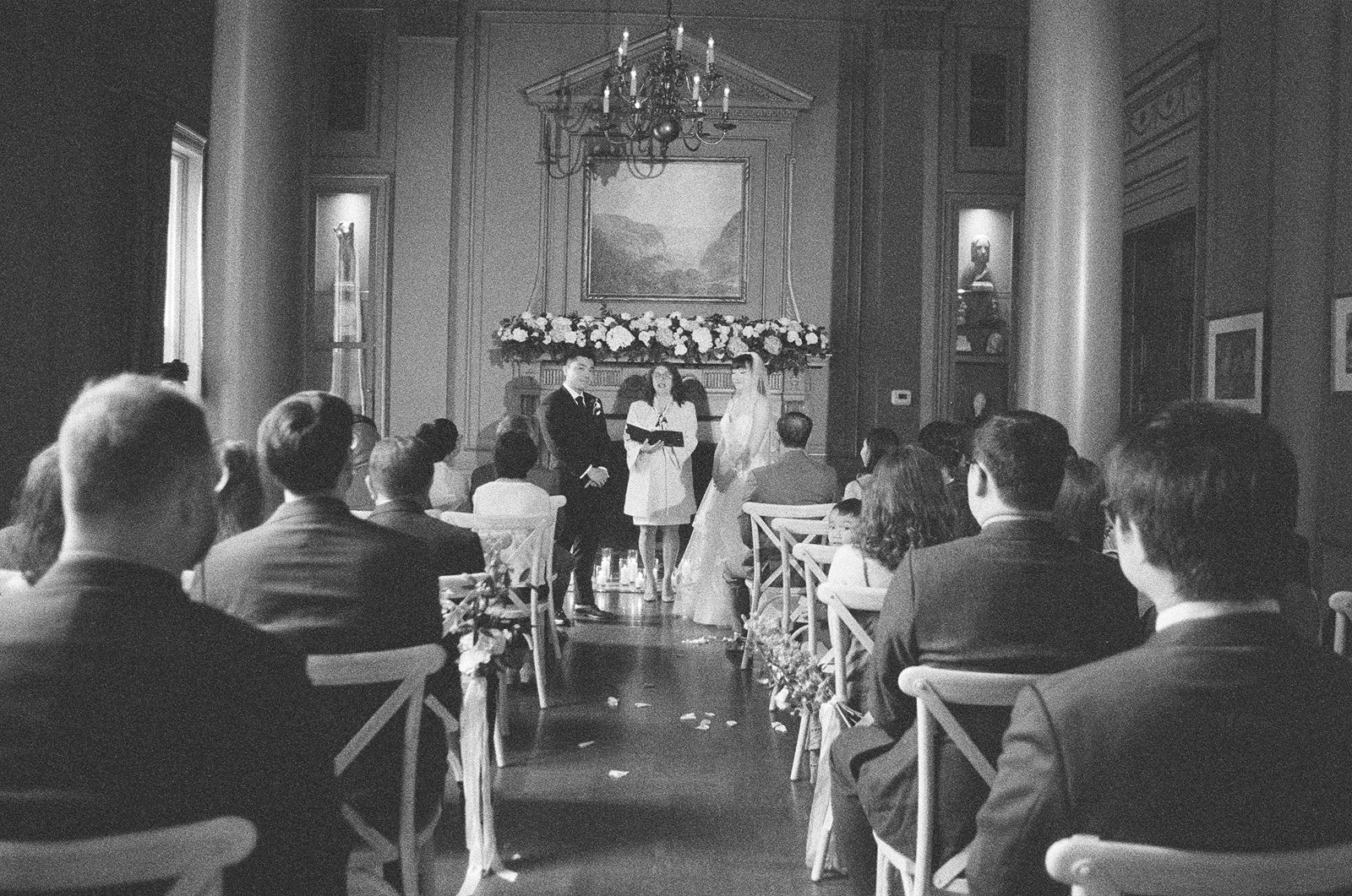 Bride and groom exchange vows at University Club of Toronto wedding