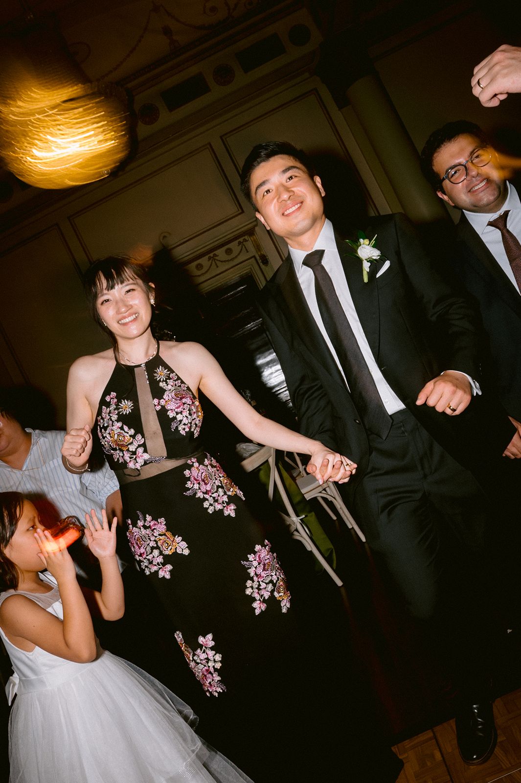 Bride and groom joining guests on the dance floor