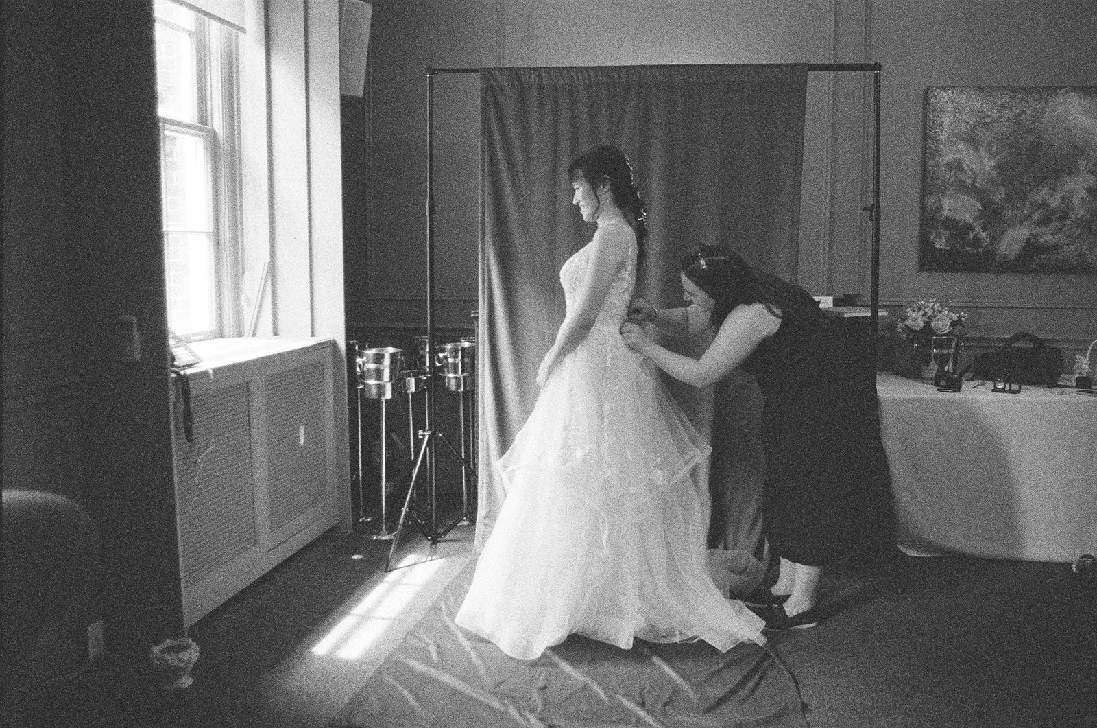 Documentary-style portrait of a bride reflecting before her ceremony.